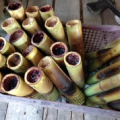 bamboo sticks stuffed with rice and pork